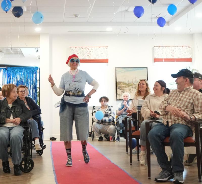 Ellie Hoffman, a resident at the Lodge at Historic Lewes, models a pair of denim shorts, designed by Cape High senior Emma Brennan, in Cape’s collaborative fashion show at the Lodge Feb. 22. ELLEN MCINTYRE PHOTOS